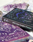2025 Annual Planner in black and purple with hologram cover