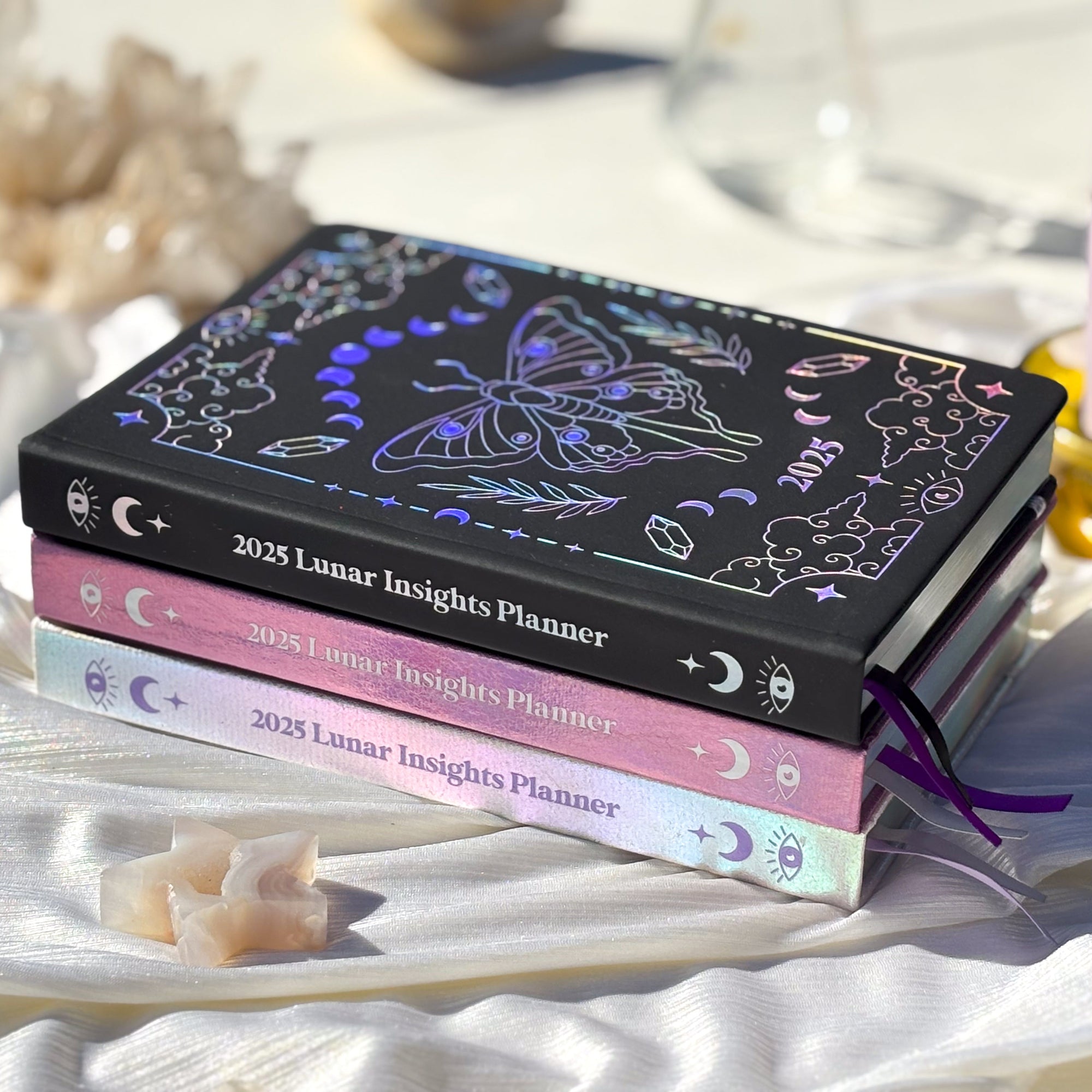 2025 Annual Moon Planner in multiple colors stacked by Goddess Provisions