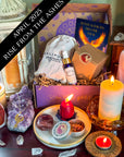 Rise From the Ashes subscription box inspired by phoenix rebirth energy, featuring magical tools for transformation, renewal, and personal empowerment.