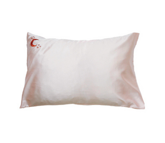 Light Pink Silk pillowcase with a brand logo on a white background