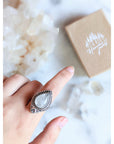 Adjustable antique silver-plated brass Clear Quartz Moonlight Ring featuring a crescent moon and crystal design. Available at Goddess Provisions