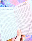 Dreamy moons manifest workbook featuring journal prompts and vision boards. Available at Goddess Provisions