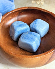 The tumbled Dumortierite is a high-vibration crystal for enhancing intuition, activating the third eye chakra, and connecting with higher realms. Available at Goddess Provisions.