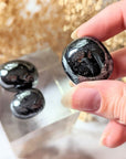 Ground your energy with Tumbled Hematite. This crystal connects to the root chakra, promoting balance and protection. Ideal for crystal healing and energetic stability. Available at Goddess Provisions.