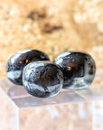 Ground your energy with Tumbled Hematite. This crystal connects to the root chakra, promoting balance and protection. Ideal for crystal healing and energetic stability. Available at Goddess Provisions.