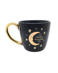 Black and celestial ceramic mug with moon and sun design available at Goddess Provisions