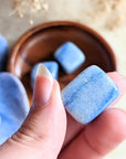 The tumbled Dumortierite is a high-vibration crystal for enhancing intuition, activating the third eye chakra, and connecting with higher realms. Available at Goddess Provisions.