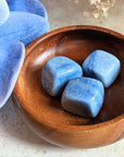 The tumbled Dumortierite is a high-vibration crystal for enhancing intuition, activating the third eye chakra, and connecting with higher realms. Available at Goddess Provisions.