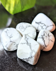 Experience tranquility with the tumbled White Howlite. This soothing crystal supports emotional balance, patience, and spiritual growth, perfect for meditation and healing rituals. Available at Goddess Provisions.