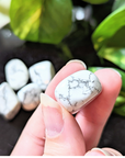 Experience tranquility with the tumbled White Howlite. This soothing crystal supports emotional balance, patience, and spiritual growth, perfect for meditation and healing rituals. Available at Goddess Provisions.