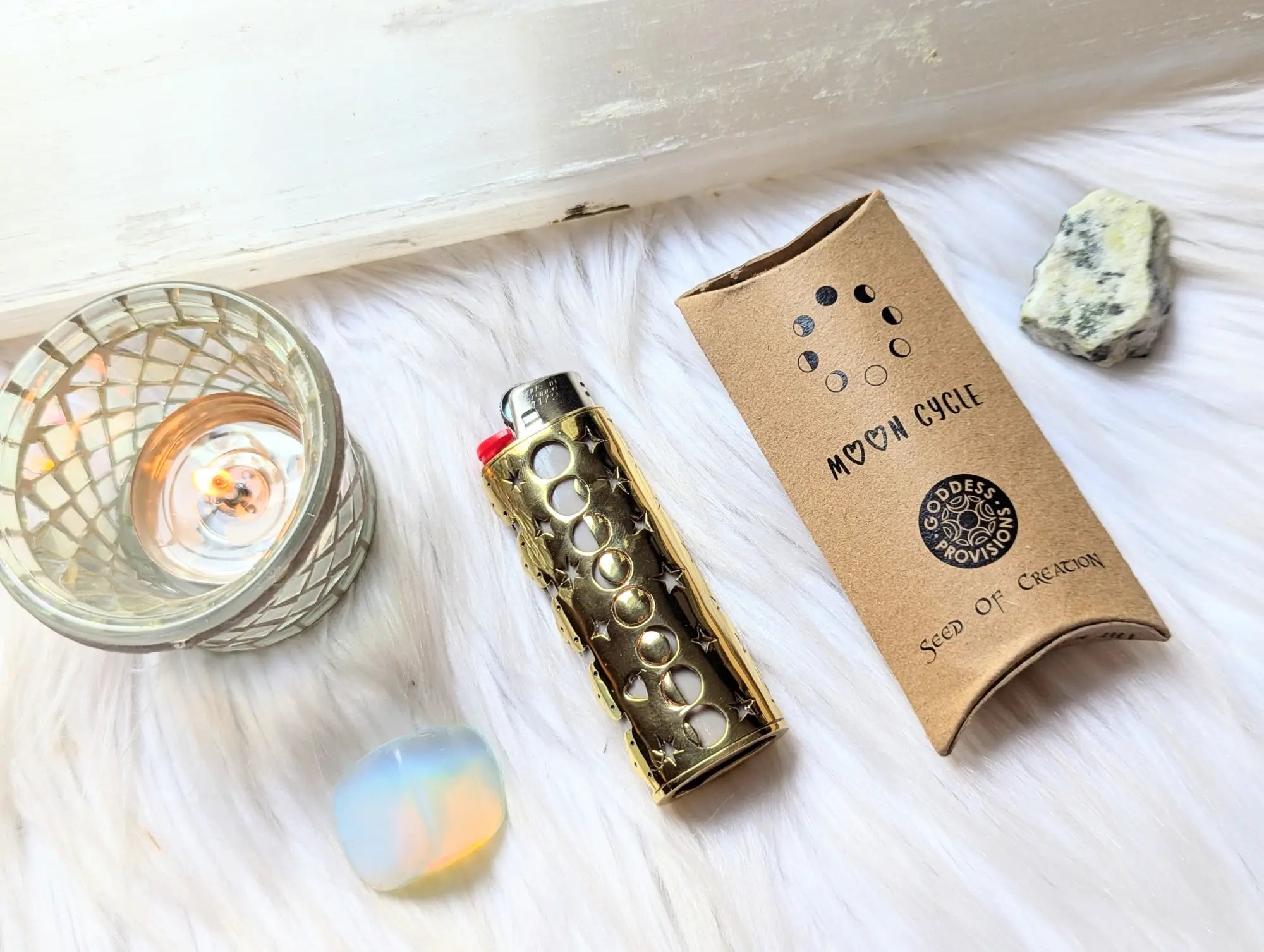 Gold-colored lighter sleeve with crescent moons and stars from Save up to 65 on metaphysical gifts collection