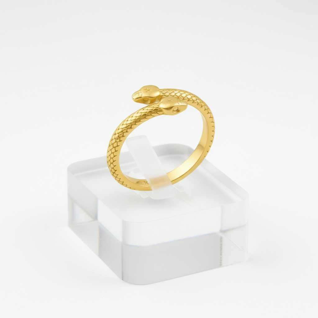 Woman wearing the 18k solid gold serpent ring as everyday heirloom fine jewelry