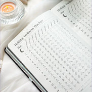 Inside pages of the 2026 planner featuring guided prompts, moon cycle references, and planning spreads.