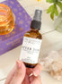 After sun spray bottle with aloe and essential oils for cooling post-sun care.