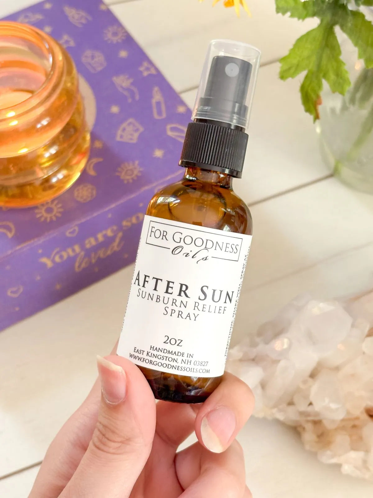 After sun spray bottle with aloe and essential oils for cooling post-sun care.