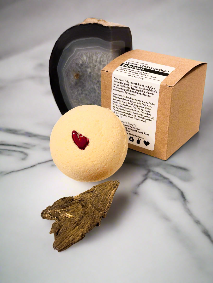 Bath Bomb with sandlewood and jasper on marble bathroom counter