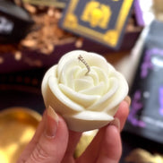 White rose candle used for ritual, meditation, and spiritual remembrance.