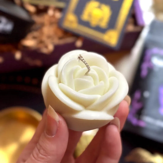 White rose candle used for ritual, meditation, and spiritual remembrance.