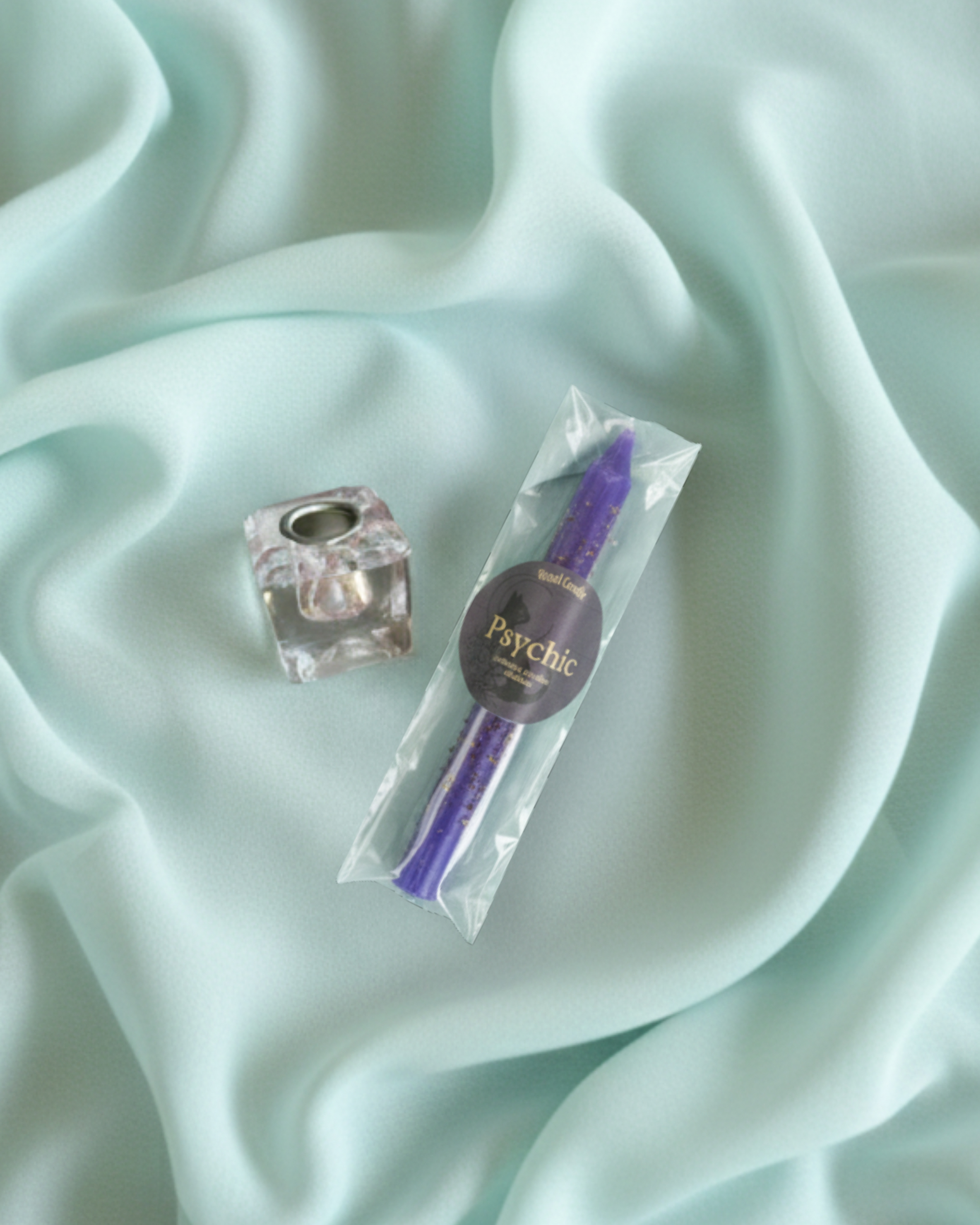 Minimalist clear glass candle holder designed for ritual and meditation practices.