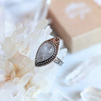 Adjustable antique silver-plated brass Clear Quartz Moonlight Ring featuring a crescent moon and crystal design. Available at Goddess Provisions