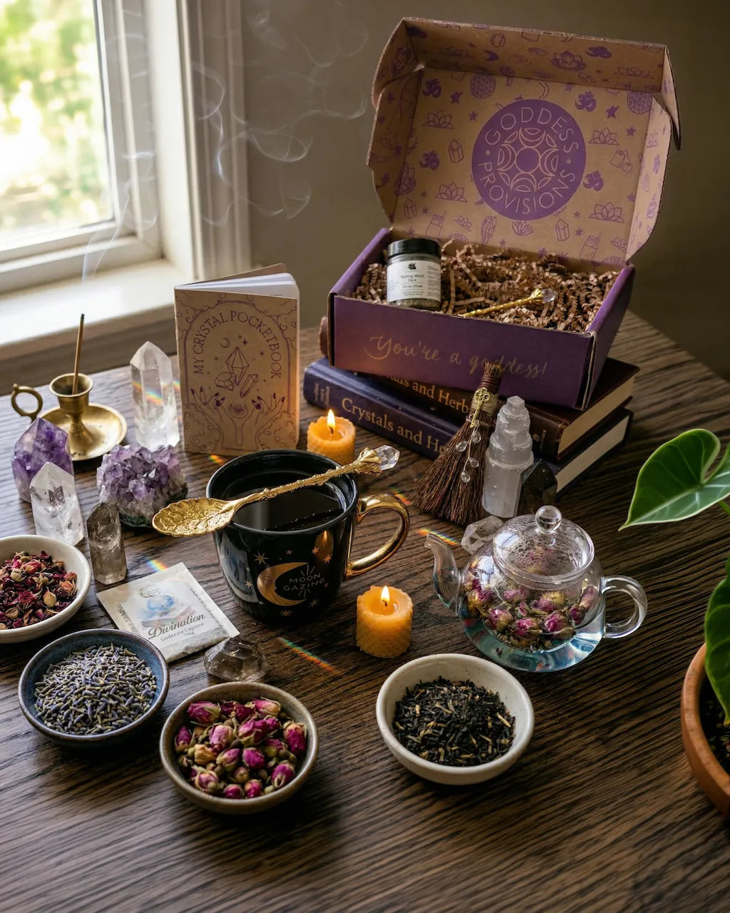 Curated spiritual ritual set with spiritual tools including crystal notebook, herbal tea, ritual spoon, facial steam, and amethyst.