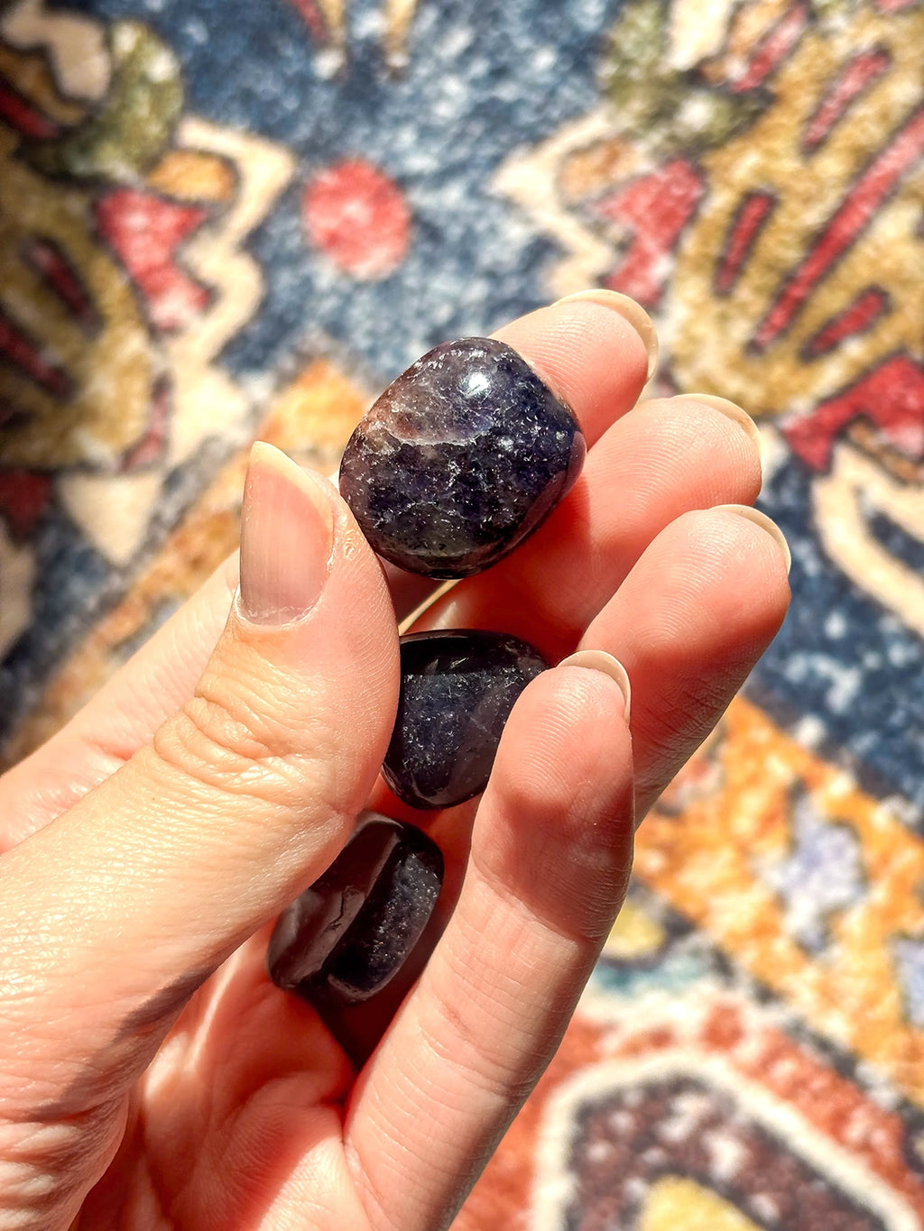 Polished Iolite crystal with deep violet-blue hues