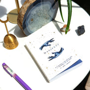 Dreamy moons manifest workbook featuring journal prompts and vision boards. Available at Goddess Provisions