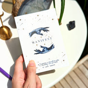 Dreamy moons manifest workbook featuring journal prompts and vision boards. Available at Goddess Provisions