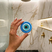 evil eye shower steamer with herbs and black obsidian for protection and energy cleansing