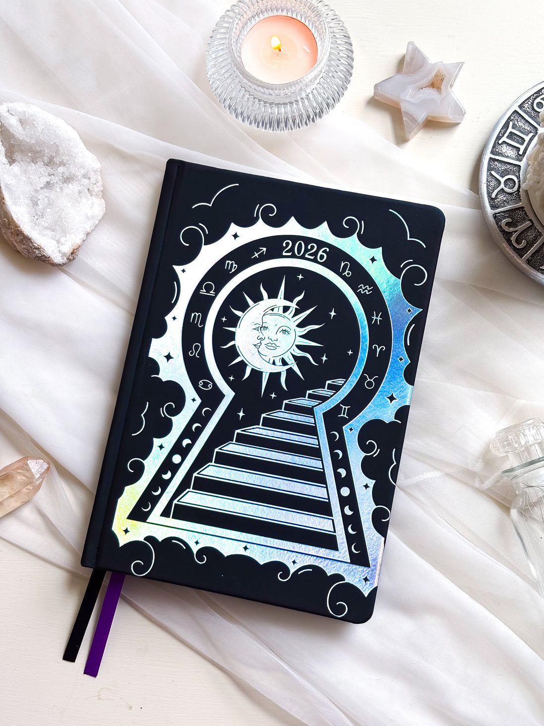 2026 planner in black vegan leather with silver holographic design.