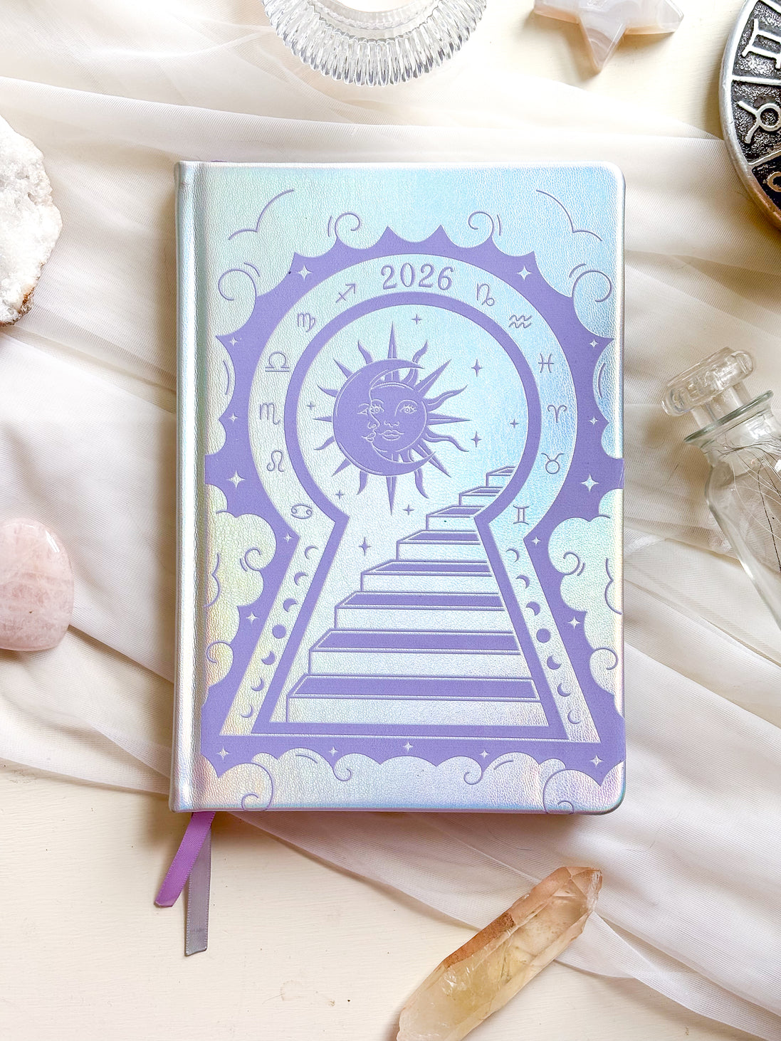 2026 planner in silver rainbow holographic vegan leather with lavender design.