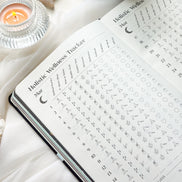 Inside pages of the 2026 planner featuring guided prompts, moon cycle references, and planning spreads.