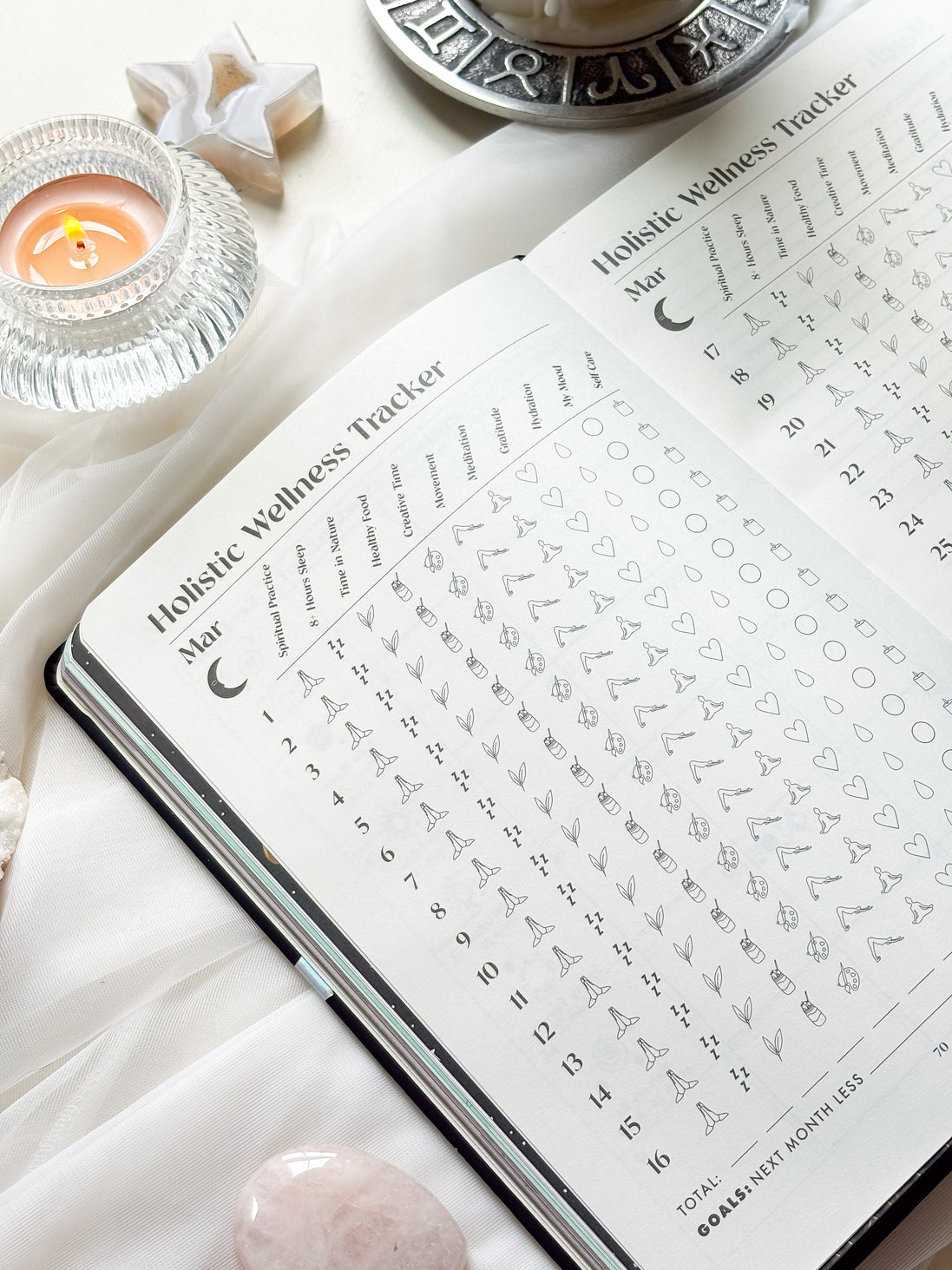 Inside pages of the 2026 planner featuring guided prompts, moon cycle references, and planning spreads.