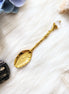 gold crystal spoon for herbs, loose leaf tea, and spiritual rituals