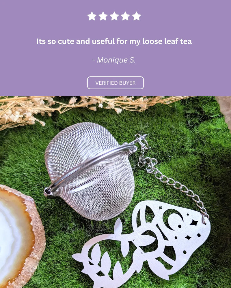 Five-star customer review praising the cute mushroom charm and easy-to-use tea infuser design.
