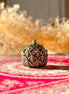 Ceramic hollow lotus incense burner with delicate floral cutouts for aromatherapy and meditation décor.