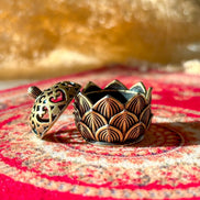 Lotus-shaped ceramic incense holder used for burning incense in yoga, meditation, or home altar spaces.