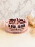 In Full Bloom crystal candle with Rhodonite crystal and Gomphrena flowers for self-love and heart healing