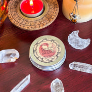 Red Phoenix Egg ritual candle with gold accents for transformation and rebirth.