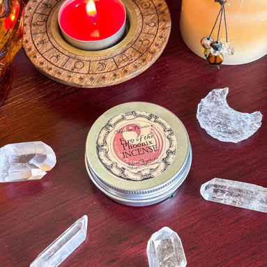 Red Phoenix Egg ritual candle with gold accents for transformation and rebirth.