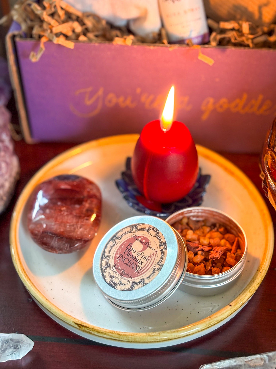 Phoenix Rebirth Ritual Bundle featuring a red Phoenix Egg Candle and Fire of the Phoenix incense.