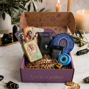 spiritual subscription box with tarot cards, protection rituals, tiger's eye crystal, and witchcraft tools for divine protection