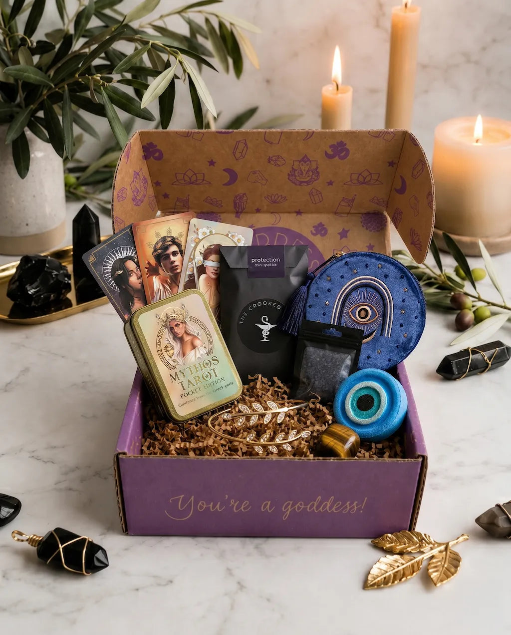 spiritual subscription box with tarot cards, protection rituals, tiger's eye crystal, and witchcraft tools for divine protection