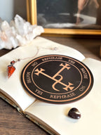 Wooden pendulum board engraved with Lilith sigil for divination and empowerment rituals.”