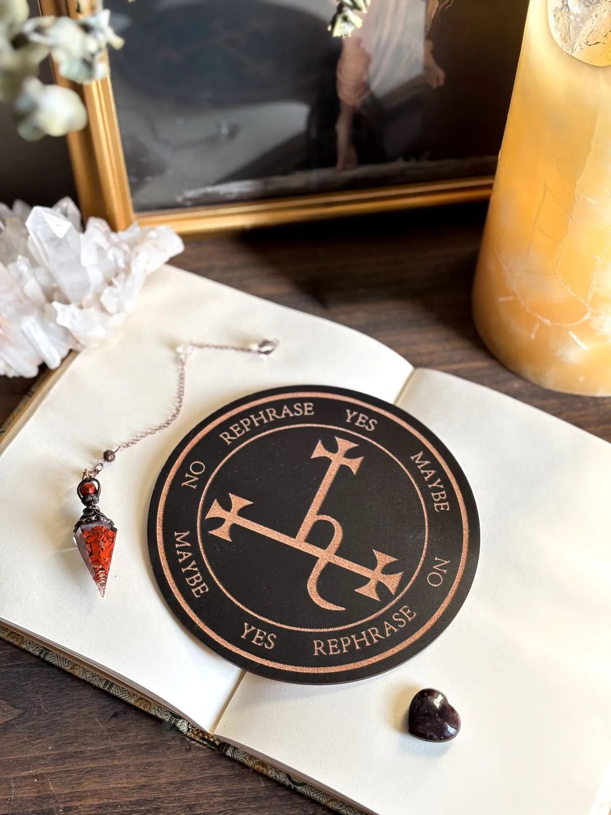 Wooden pendulum board engraved with Lilith sigil for divination and empowerment rituals.