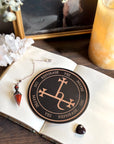 Wooden pendulum board engraved with Lilith sigil for divination and empowerment rituals.