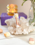 Lip balm on a crystal structure with a blurred background