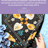 Customer review sharing how the tea towel adds a cozy mystical touch to their kitchen decor.