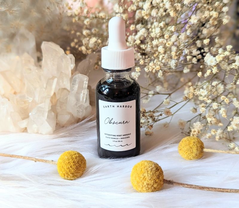 Detoxify and rejuvenate your skin with Obscura Ampoule Serum. Infused with Black Seaweed and Bamboo Charcoal, this vegan elixir refreshes all skin types. Available at Goddess Provisions.