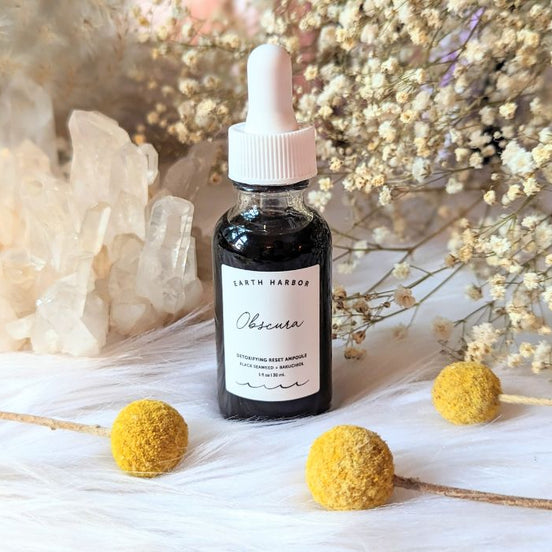 Detoxify and rejuvenate your skin with Obscura Ampoule Serum. Infused with Black Seaweed and Bamboo Charcoal, this vegan elixir refreshes all skin types. Available at Goddess Provisions.